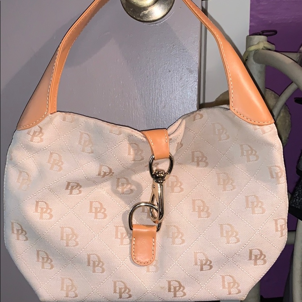 Dooney and Bourke satchel with gold hardware. New
